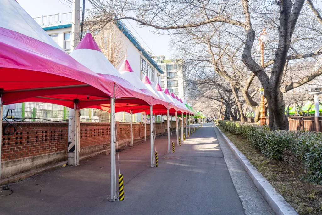 This is an event booth preparing for a festival. It's a place selling a variety of food and souvenirs.