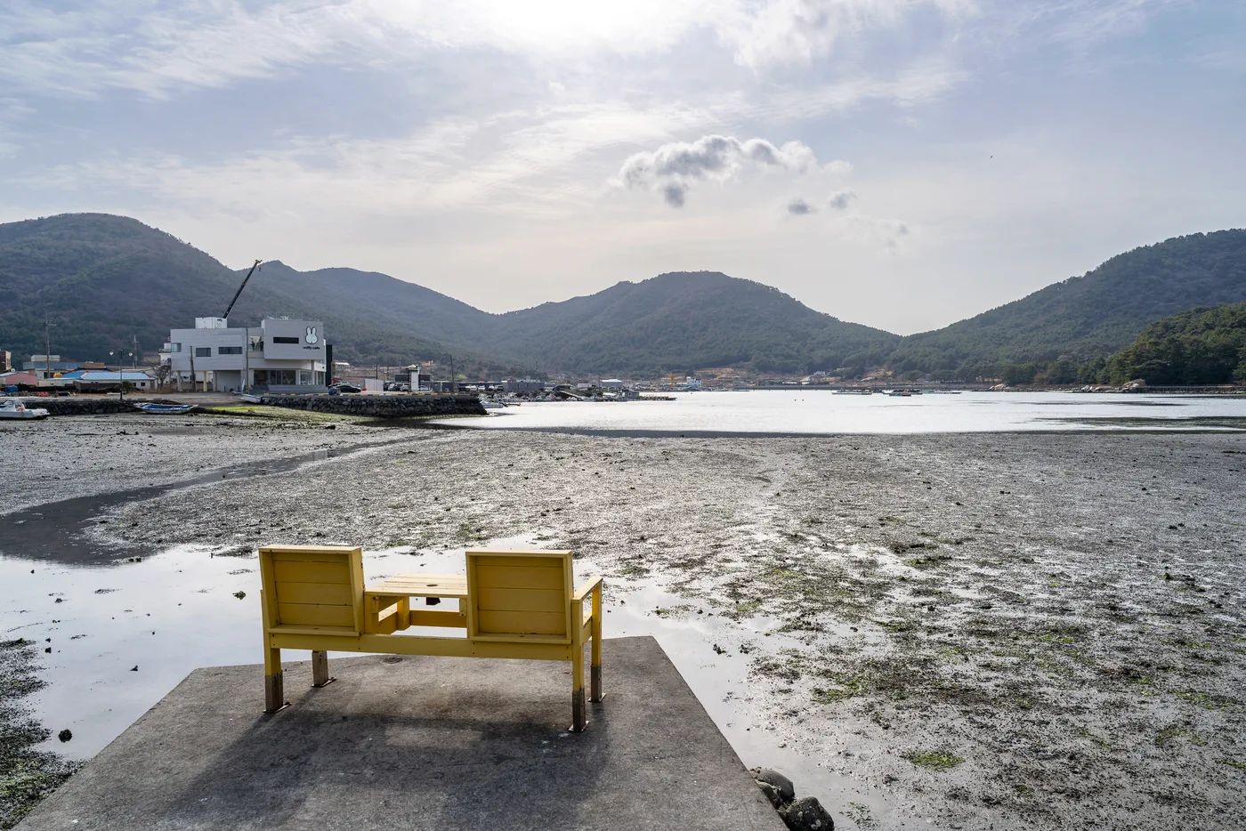 Front seats outside the shop at low tide.